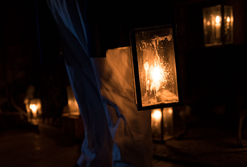 Candles lighting up in the dark