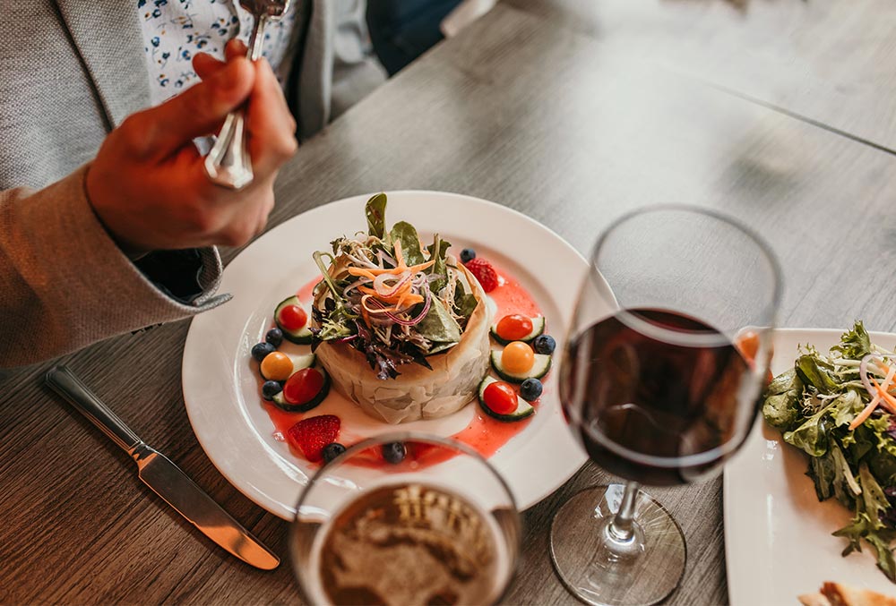 Photo of a person eating brunch at Queenston Heights Restaurant