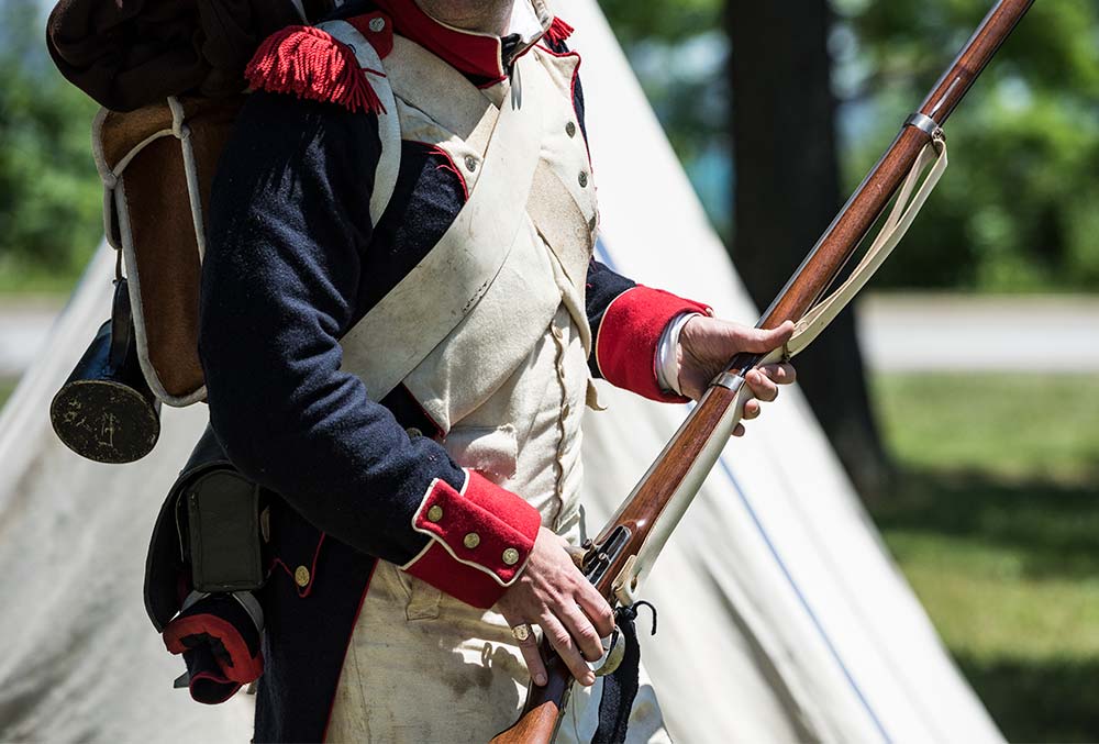 A Napoleonic War soldier holding an armed weapon